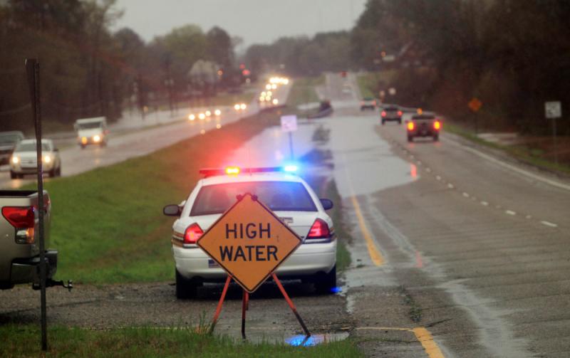 Police monitor floodwaters in Haughton, La., in March. The state has expanded its hate-crime laws to also protect law enforcement and first responders. Police monitor floodwaters in Haughton, La., in March. The state has expanded its hate-crime laws to also protect law enforcement and first responders.
