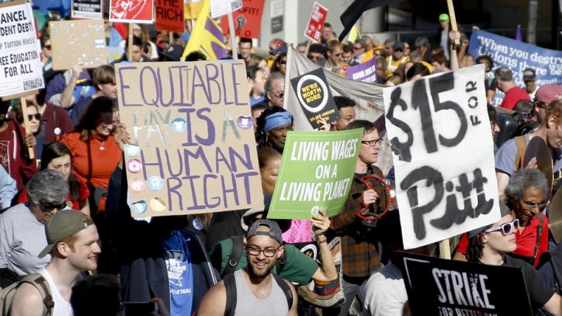 Union organizers, students and supporters for a $15 an hour wage march in Pittsburgh in April. Washington, D.C., is the latest city to move toward the wage increase. Union organizers, students and supporters for a $15 an hour wage march in Pittsburgh in April. Washington, D.C., is the latest city to move toward the wage increase.