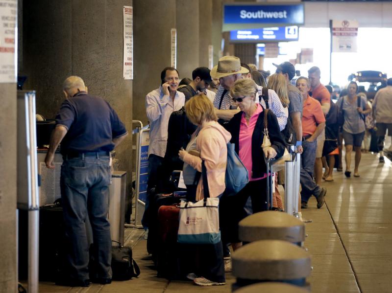 Passengers line up to check in before their flights in May at Sky Harbor International Airport in Phoenix. Two new automated security lanes at the Atlanta Airport are aimed at reducing long wait times. Passengers line up to check in before their flights in May at Sky Harbor International Airport in Phoenix. Two new automated security lanes at the Atlanta Airport are aimed at reducing long wait times.