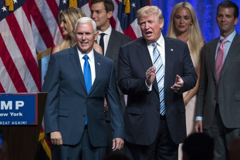 Republican presidential candidate Donald Trump (right) introduces Gov. Mike Pence, R-Ind., during a campaign event to announce Pence as his vice presidential running mate on Saturday. Republican presidential candidate Donald Trump (right) introduces Gov. Mike Pence, R-Ind., during a campaign event to announce Pence as his vice presidential running mate on Saturday.