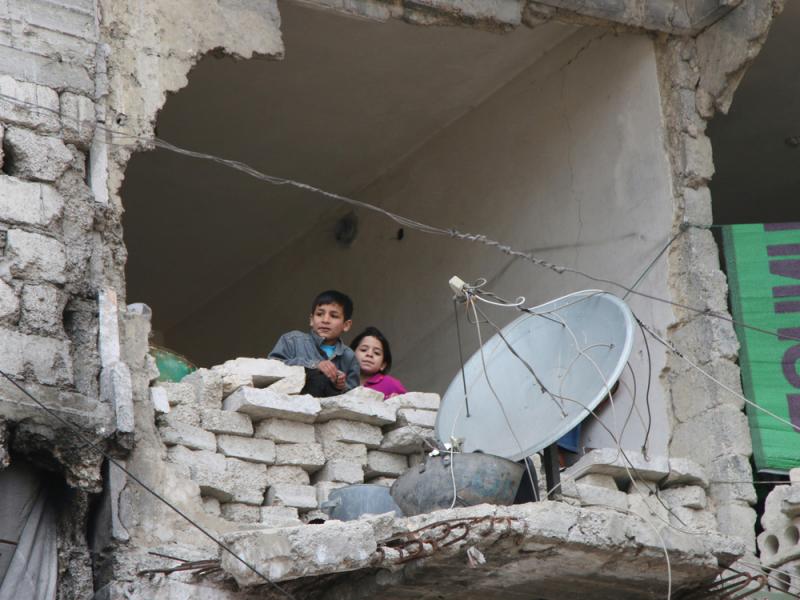 Children peer from a partially destroyed home in Aleppo, Syria in February. Syria's largest city used to be its economic locomotive, now it is has become an emblem of its stalemated civil war. Children peer from a partially destroyed home in Aleppo, Syria in February. Syria's largest city used to be its economic locomotive, now it is has become an emblem of its stalemated civil war.