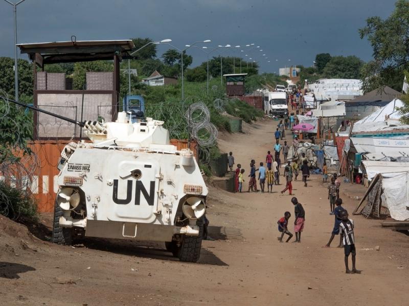 Some of the more than 30,000 Nuer civilians sheltering in a United Nations base in South Sudan's capital Juba for fear of targeted killings by government forces walk by an armored vehicle and a watchtower manned by Chinese peacekeepers. Some of the more than 30,000 Nuer civilians sheltering in a United Nations base in South Sudan's capital Juba for fear of targeted killings by government forces walk by an armored vehicle and a watchtower manned by Chinese peacekeepers.