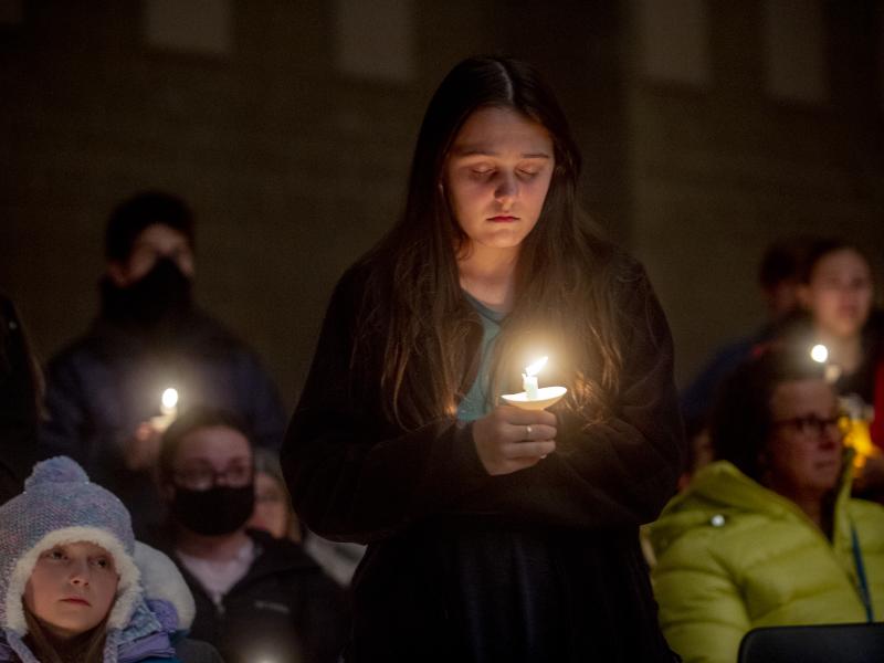 Students hold candles during a prayer vigil after the shootings at Oxford High School on Tuesday in Oxford, Mich. Students hold candles during a prayer vigil after the shootings at Oxford High School on Tuesday in Oxford, Mich.