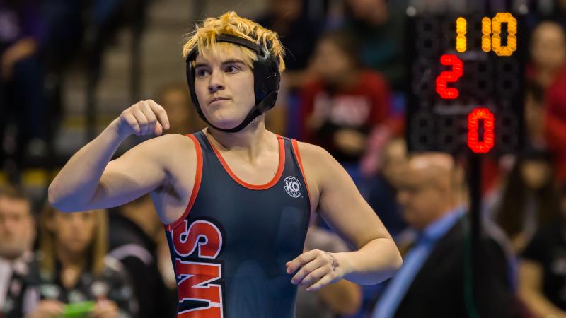Trinity High School junior Mack Beggs waits for a signal from the referee in the final round of the 6A Girls 110 Weight Class match during the Texas Wrestling State Tournament on Saturday in Cypress, Texas. Beggs, a transgender boy, is required by state p Trinity High School junior Mack Beggs waits for a signal from the referee in the final round of the 6A Girls 110 Weight Class match during the Texas Wrestling State Tournament on Saturday in Cypress, Texas. Beggs, a transgender boy, is required by state p