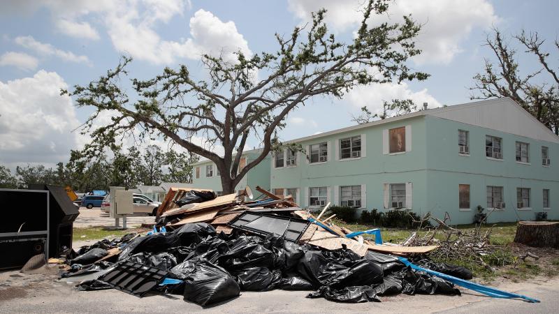 Debris is piled on May 10 outside an apartment complex that was damaged by Hurricane Michael in Panama City, Fla. Rep. Chip Roy objected to a procedural vote on a bipartisan $19.1 billion disaster aid bill, forcing Congress to wait until June to finish wo Debris is piled on May 10 outside an apartment complex that was damaged by Hurricane Michael in Panama City, Fla. Rep. Chip Roy objected to a procedural vote on a bipartisan $19.1 billion disaster aid bill, forcing Congress to wait until June to finish wo