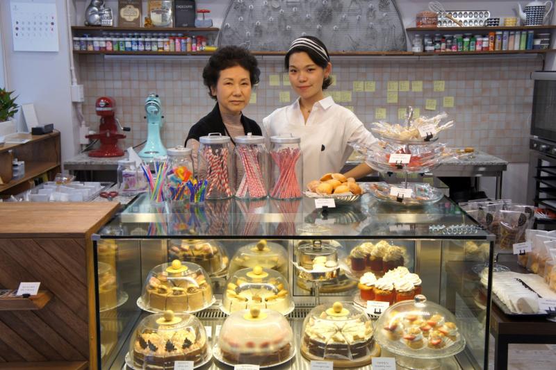 In this photo, Younghwa Chun (left) and Euni Cho celebrate the opening of Sweet Studio Dal D patisserie in Seoul, South Korea, in 2017. Chun was a toddler when her family fled North Korea, and doesn't have memories of life there. In this photo, Younghwa Chun (left) and Euni Cho celebrate the opening of Sweet Studio Dal D patisserie in Seoul, South Korea, in 2017. Chun was a toddler when her family fled North Korea, and doesn't have memories of life there.