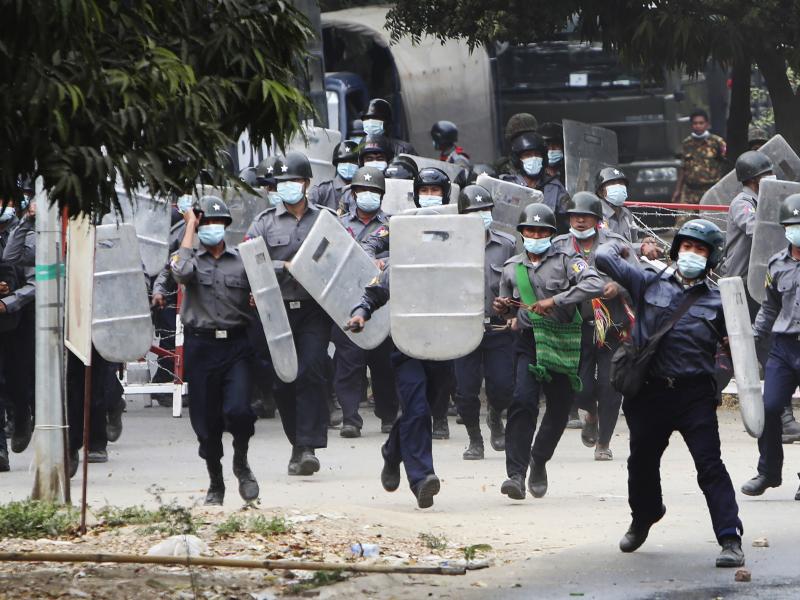 Police charge forward to disperse protesters in Mandalay, Myanmar, on Saturday. Security forces ratcheted up their pressure against anti-coup protesters, using water cannons, tear gas, slingshots and rubber bullets. Police charge forward to disperse protesters in Mandalay, Myanmar, on Saturday. Security forces ratcheted up their pressure against anti-coup protesters, using water cannons, tear gas, slingshots and rubber bullets.