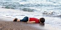 Alan Kurdi's body lies on the shores of Bodrum, southern Turkey, in September 2015 after a boat carrying 23 migrants sank while reaching the Greek island of Kos. Alan Kurdi's body lies on the shores of Bodrum, southern Turkey, in September 2015 after a boat carrying 23 migrants sank while reaching the Greek island of Kos.