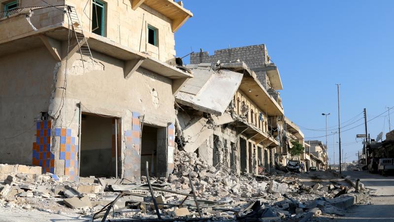 Buildings and debris in Aleppo's Darat Izza district, in Syria, on Sunday. Buildings and debris in Aleppo's Darat Izza district, in Syria, on Sunday.
