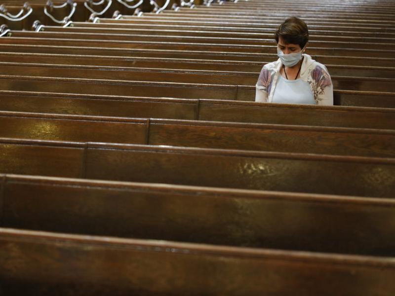 A parishioner sits after Mass last month at a Catholic church in New York City. An overwhelming majority of U.S. adults believe that houses of worship should be subject to the same restrictions on public gatherings that apply to other institutions. A parishioner sits after Mass last month at a Catholic church in New York City. An overwhelming majority of U.S. adults believe that houses of worship should be subject to the same restrictions on public gatherings that apply to other institutions.