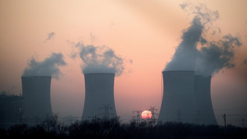 Water vapor, which looks like smoke, is seen rising from a power plant near Hengshui in China's Hebei province. In November, President Obama announced a landmark carbon-cutting deal with China — the world's leading producer of greenhouse gases. And the Water vapor, which looks like smoke, is seen rising from a power plant near Hengshui in China's Hebei province. In November, President Obama announced a landmark carbon-cutting deal with China — the world's leading producer of greenhouse gases. And the