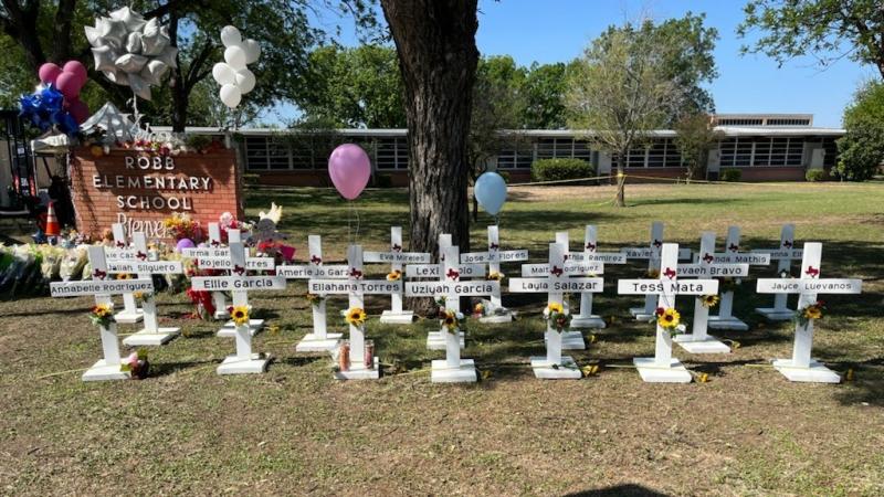 A memorial to the students and faculty who died stands in front of Robb Elementary School in Uvalde, Texas. It's not clear who put the memorial up and authorities have not released the names of the deceased. A memorial to the students and faculty who died stands in front of Robb Elementary School in Uvalde, Texas. It's not clear who put the memorial up and authorities have not released the names of the deceased.