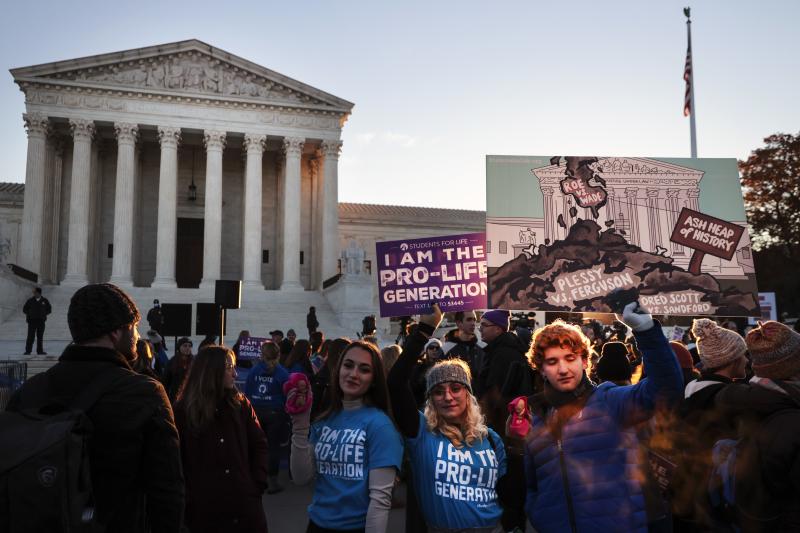 Activists and demonstrators gather in front of the U.S. Supreme Court as the justices hear arguments in Dobbs v. Jackson Women's Health. Activists and demonstrators gather in front of the U.S. Supreme Court as the justices hear arguments in Dobbs v. Jackson Women's Health.