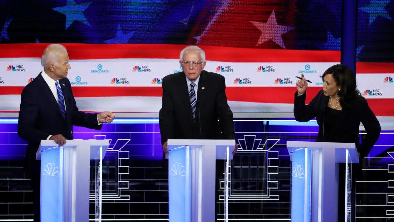 Sen. Bernie Sanders is in the middle as former Vice President Joe Biden and Sen. Kamala Harris face off in the June 27 debate in Miami. Harris and Biden will again share center stage in the July 31 debate. Sen. Bernie Sanders is in the middle as former Vice President Joe Biden and Sen. Kamala Harris face off in the June 27 debate in Miami. Harris and Biden will again share center stage in the July 31 debate.