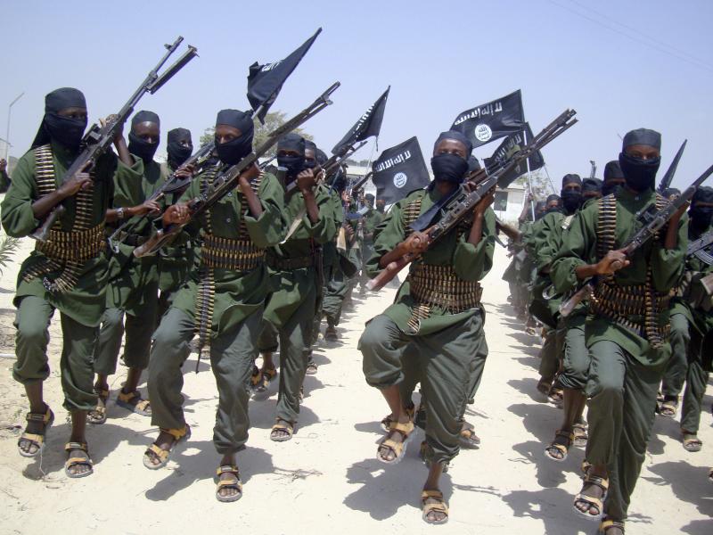 Al-Shabab fighters march with their weapons during military exercises on the outskirts of Mogadishu, Somalia, in 2011. Al-Shabab fighters march with their weapons during military exercises on the outskirts of Mogadishu, Somalia, in 2011.