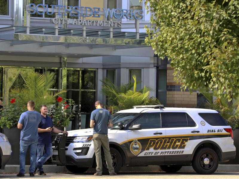 Pittsburgh police investigators gather outside an apartment building on the city's South Side where police say multiple people are dead and others are hospitalized in what they believe to be an isolated drug overdose incident. Pittsburgh police investigators gather outside an apartment building on the city's South Side where police say multiple people are dead and others are hospitalized in what they believe to be an isolated drug overdose incident.