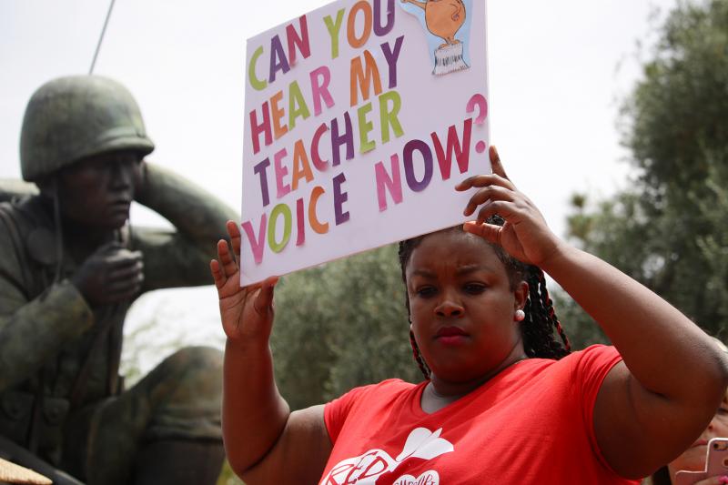 In April, public school teachers in Arizona protest for more school funding and higher teacher wages. In April, public school teachers in Arizona protest for more school funding and higher teacher wages.