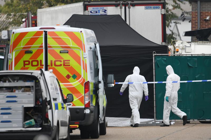 A police forensic investigation team walks near the site where 39 bodies were discovered in the back of a truck on Wednesday in Waterglade Industrial Park in Grays, England. Police believe the truck is from Bulgaria, a member of the European Union, and th A police forensic investigation team walks near the site where 39 bodies were discovered in the back of a truck on Wednesday in Waterglade Industrial Park in Grays, England. Police believe the truck is from Bulgaria, a member of the European Union, and th