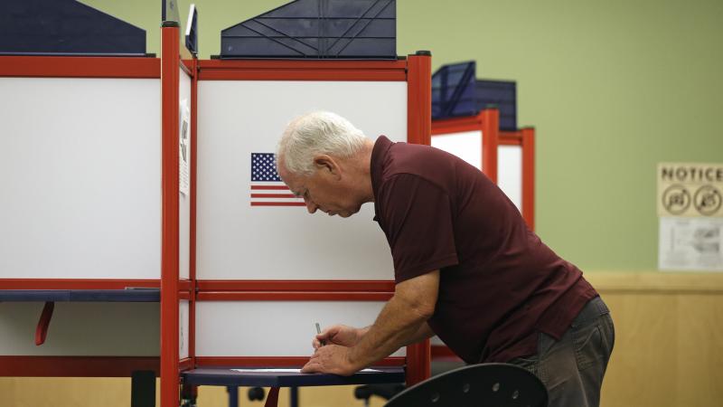 Rick Colyer votes at the Durham County Library North Regional in Durham, N.C., Tuesday. Rick Colyer votes at the Durham County Library North Regional in Durham, N.C., Tuesday.