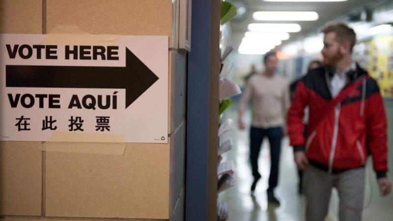 People exit the building after voting at Public School 321 in Brooklyn on Tuesday. People exit the building after voting at Public School 321 in Brooklyn on Tuesday.