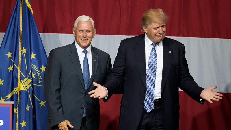 Presumptive Republican presidential candidate Donald Trump (right) and Indiana Gov. Mike Pence take the stage during a campaign rally at Grant Park Event Center in Westfield, Ind. Presumptive Republican presidential candidate Donald Trump (right) and Indiana Gov. Mike Pence take the stage during a campaign rally at Grant Park Event Center in Westfield, Ind.