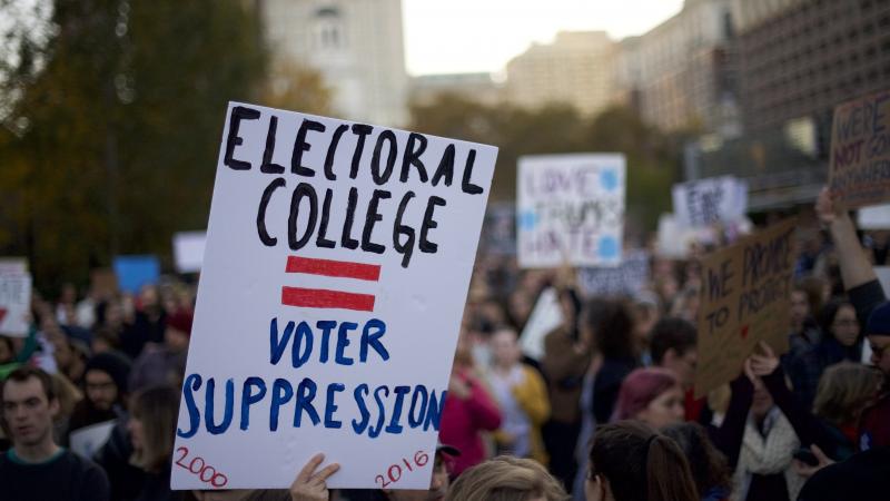 Protesters demonstrate in Philadelphia last week. Republican Donald Trump is assured of a victory, unless there is a massive — and totally unexpected — defection by the electors pledged to support him. Protesters demonstrate in Philadelphia last week. Republican Donald Trump is assured of a victory, unless there is a massive — and totally unexpected — defection by the electors pledged to support him.