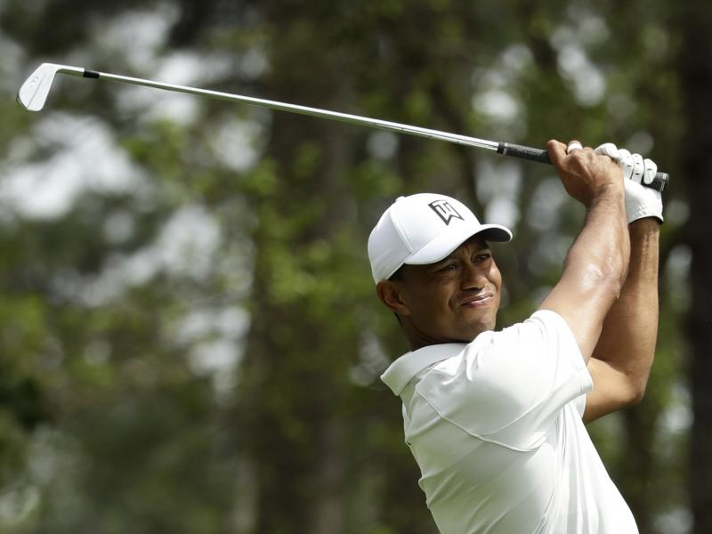 Tiger Woods hits on the fourth hole during the second round at the Masters golf tournament Friday. Tiger Woods hits on the fourth hole during the second round at the Masters golf tournament Friday.