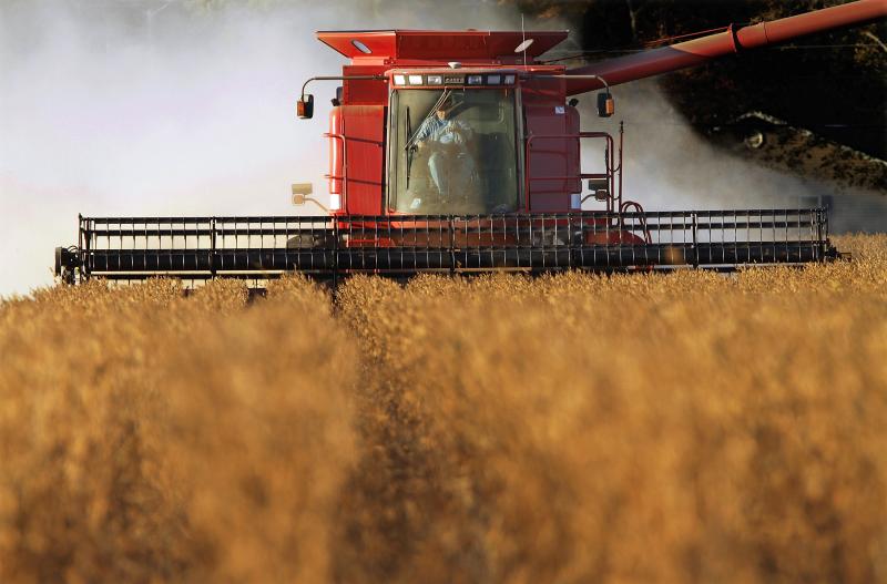A farmer harvests his soybean crops near Farmingdale, Ill. Because China is major importer of America's soybeans, the sector is one predicted target for tariff retaliation. A farmer harvests his soybean crops near Farmingdale, Ill. Because China is major importer of America's soybeans, the sector is one predicted target for tariff retaliation.