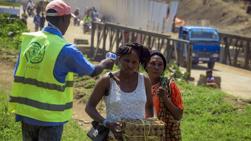 Uganda has reported its first death from Ebola. Here, a health worker takes a woman's temperature at a border crossing between Uganda and Democratic Republic of the Congo, part of an effort to screen for Ebola and prevent its spread. Uganda has reported its first death from Ebola. Here, a health worker takes a woman's temperature at a border crossing between Uganda and Democratic Republic of the Congo, part of an effort to screen for Ebola and prevent its spread.