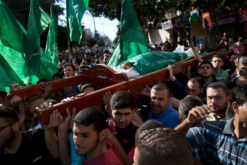 Palestinians carry the body of Mousab Abu Leila, 29, at his funeral after he was killed along the Gaza border during a protest against the U.S. move of its embassy to Jerusalem. Palestinians carry the body of Mousab Abu Leila, 29, at his funeral after he was killed along the Gaza border during a protest against the U.S. move of its embassy to Jerusalem.