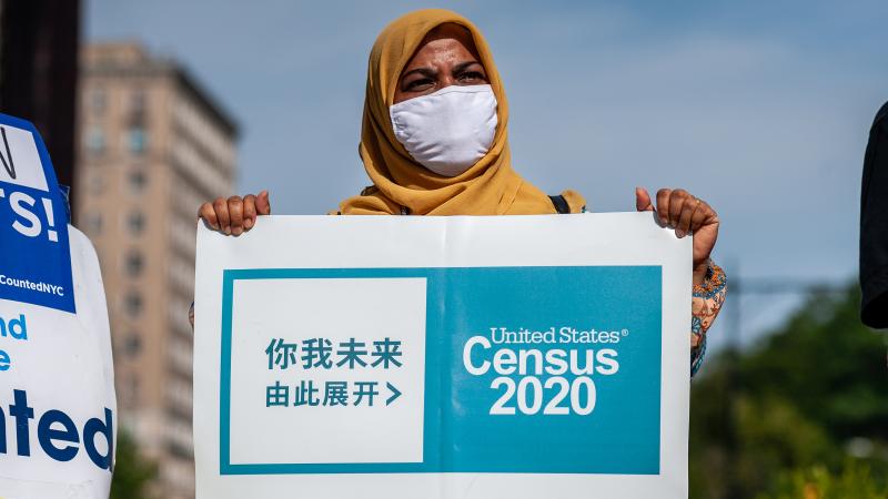 A census supporter holds up a sign during a 2020 rally in New York City. A census supporter holds up a sign during a 2020 rally in New York City.