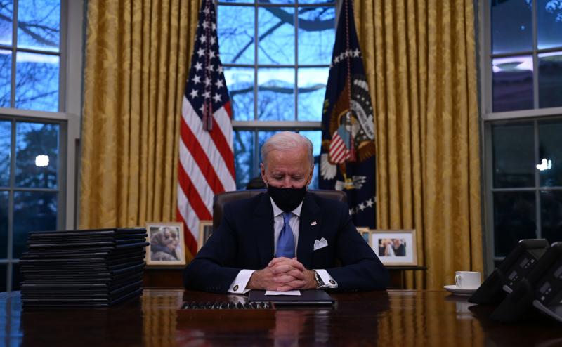 President Biden sits in the Oval Office at the White House after being sworn in as the 46th president of the United States on Wednesday. President Biden sits in the Oval Office at the White House after being sworn in as the 46th president of the United States on Wednesday.