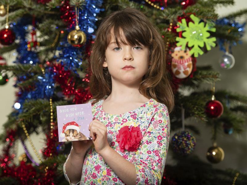 Florence Widdicombe, 6, poses with a Christmas card from the same pack as a card she found containing a message apparently from foreign prisoners in China. The U.K.-based grocery chain Tesco has halted production at the factory in China that supplied the Florence Widdicombe, 6, poses with a Christmas card from the same pack as a card she found containing a message apparently from foreign prisoners in China. The U.K.-based grocery chain Tesco has halted production at the factory in China that supplied the