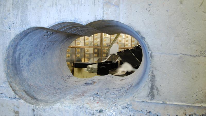 This image, supplied by the Metropolitan Police, shows a view of the hole drilled in the vault wall at Hatton Garden Safe Deposit Ltd. following the Easter weekend robbery last year in London. Millions of dollars worth of jewels, cash and other valuable i This image, supplied by the Metropolitan Police, shows a view of the hole drilled in the vault wall at Hatton Garden Safe Deposit Ltd. following the Easter weekend robbery last year in London. Millions of dollars worth of jewels, cash and other valuable i
