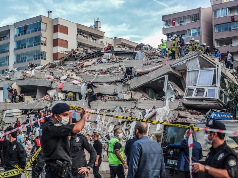 Rescuers search for survivors Friday in a collapsed building in Izmir, Turkey, after a powerful earthquake struck Turkey's western coast and parts of Greece. Rescuers search for survivors Friday in a collapsed building in Izmir, Turkey, after a powerful earthquake struck Turkey's western coast and parts of Greece.