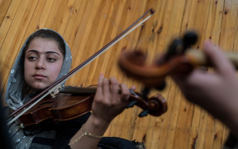 Marjan practices at the Afghanistan National Institute of Music in Kabul. Marjan practices at the Afghanistan National Institute of Music in Kabul.