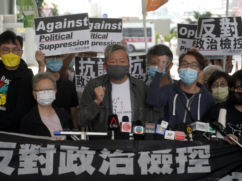 Pro-democracy activist Lee Cheuk-yan, center, arrives at a court in Hong Kong Friday. Seven of Hong Kong's leading pro-democracy advocates, including Lee, and pro-democracy media tycoon Jimmy Lai, were sentenced Friday for organizing a march during the 2 Pro-democracy activist Lee Cheuk-yan, center, arrives at a court in Hong Kong Friday. Seven of Hong Kong's leading pro-democracy advocates, including Lee, and pro-democracy media tycoon Jimmy Lai, were sentenced Friday for organizing a march during the 2