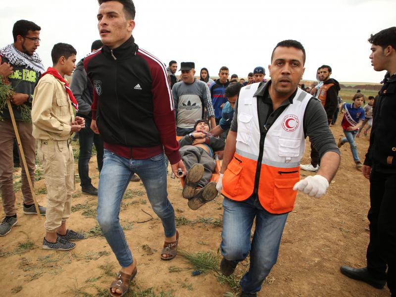 A Palestinian youth is carried on a stretcher Friday after being injured during a demonstration near the border with Israel east of Jabalia in Gaza. A Palestinian youth is carried on a stretcher Friday after being injured during a demonstration near the border with Israel east of Jabalia in Gaza.