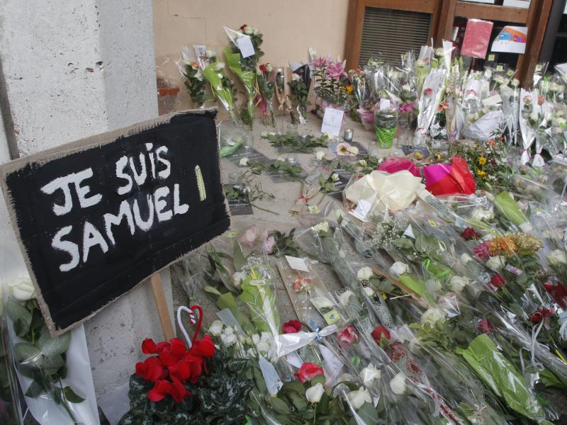 Authorities in France say they've detained nine people in connection with the decapitation of a history teacher in a Paris suburb on Friday. The teacher had shown caricatures of the Prophet Muhammad to his class, authorities said. Authorities in France say they've detained nine people in connection with the decapitation of a history teacher in a Paris suburb on Friday. The teacher had shown caricatures of the Prophet Muhammad to his class, authorities said.