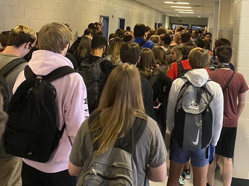 Officials at North Paulding High School in Dallas, Ga have suspended in-person learning for at least two days following a cluster of virus cases was discovered at the school. Above a crowd of students packs a hallway on Aug. 4. Officials at North Paulding High School in Dallas, Ga have suspended in-person learning for at least two days following a cluster of virus cases was discovered at the school. Above a crowd of students packs a hallway on Aug. 4.