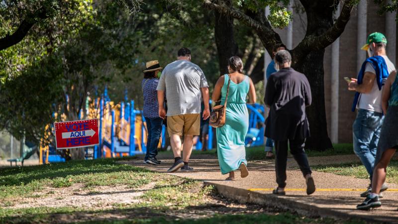 Voters approach a polling location in Austin, Texas, on Oct. 13 — the first day of voting in the state. Nearly 10 million ballots have already been cast in Texas — more than 2016's total votes in the state. Voters approach a polling location in Austin, Texas, on Oct. 13 — the first day of voting in the state. Nearly 10 million ballots have already been cast in Texas — more than 2016's total votes in the state.