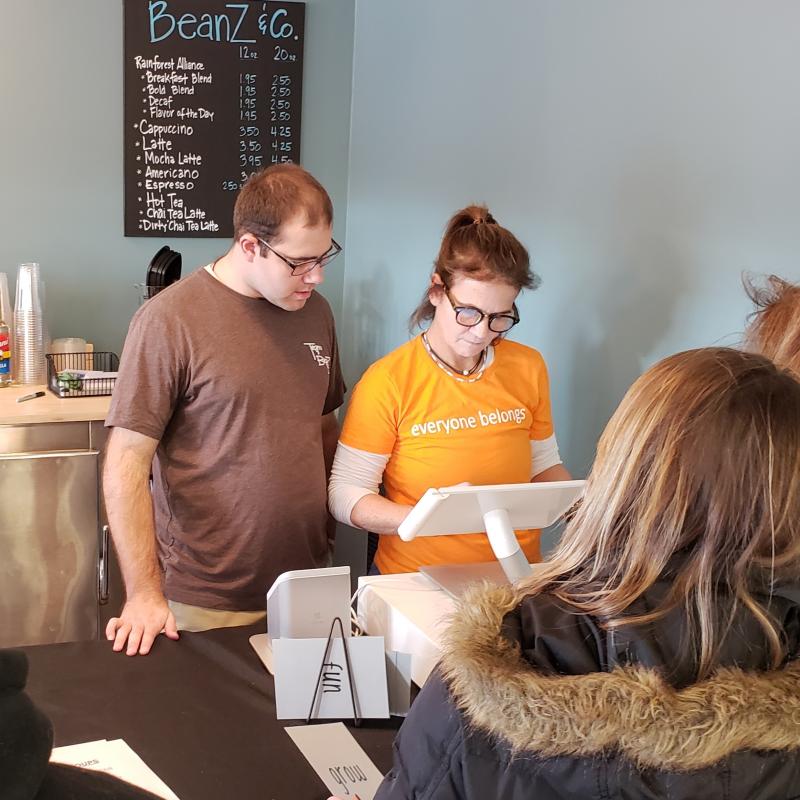 Kim Morrison, (right) co-owner of Beanz & Co. Cafe in Avon, Conn., with her employee, Nick Sinacori, as they serve customers during their opening week. Kim Morrison, (right) co-owner of Beanz & Co. Cafe in Avon, Conn., with her employee, Nick Sinacori, as they serve customers during their opening week.