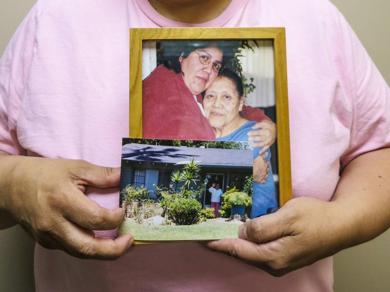 Maria Rivas holds photographs of her mother, Julia Medina, who died in 2012. Maria cared for Julia for six years at the end of her life. Maria Rivas holds photographs of her mother, Julia Medina, who died in 2012. Maria cared for Julia for six years at the end of her life.
