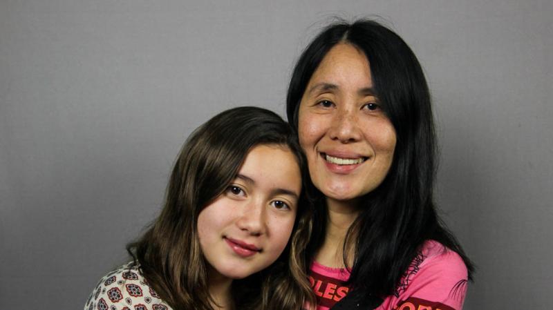 Lan Cao, 53, with her daughter, Harlan, 12, at their StoryCorps interview in Westminster, Calif. in January 2015. During the interview, Lan tells her daughter about her experience during the Tet Offensive in Vietnam in 1968. Lan Cao, 53, with her daughter, Harlan, 12, at their StoryCorps interview in Westminster, Calif. in January 2015. During the interview, Lan tells her daughter about her experience during the Tet Offensive in Vietnam in 1968.