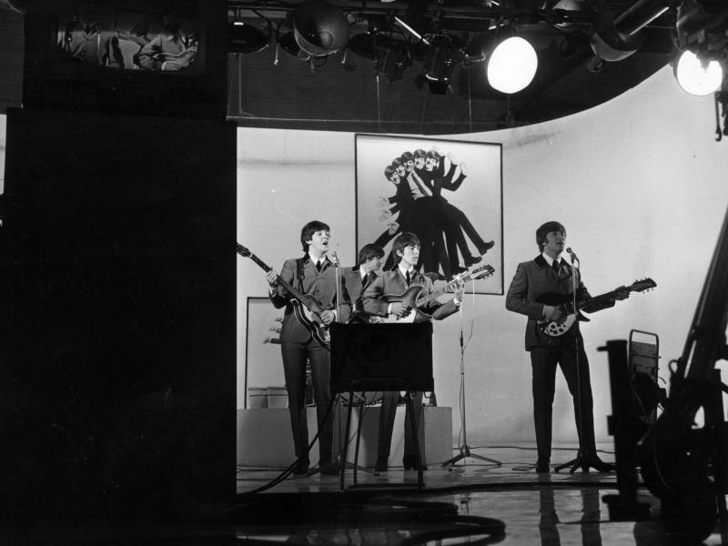 The Beatles perform one of their songs while filming A Hard Day's Night in 1964. The Beatles perform one of their songs while filming A Hard Day's Night in 1964.