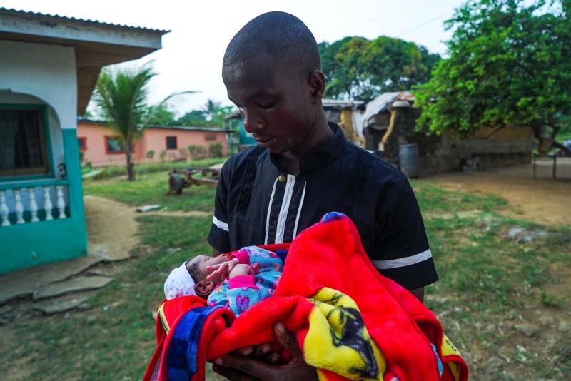 James Harris holds his newborn son, Jeremiah Solomon Karwah. James Harris holds his newborn son, Jeremiah Solomon Karwah.