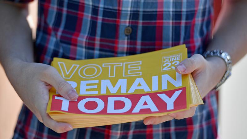 A young man hands out "Remain" leaflets outside the polling station at Notre Dame Primary School on Thursday in Glasgow, Scotland. As a nation, Scotland voted to remain in the EU; but as a whole, the United Kingdom opted to leave. A young man hands out "Remain" leaflets outside the polling station at Notre Dame Primary School on Thursday in Glasgow, Scotland. As a nation, Scotland voted to remain in the EU; but as a whole, the United Kingdom opted to leave.