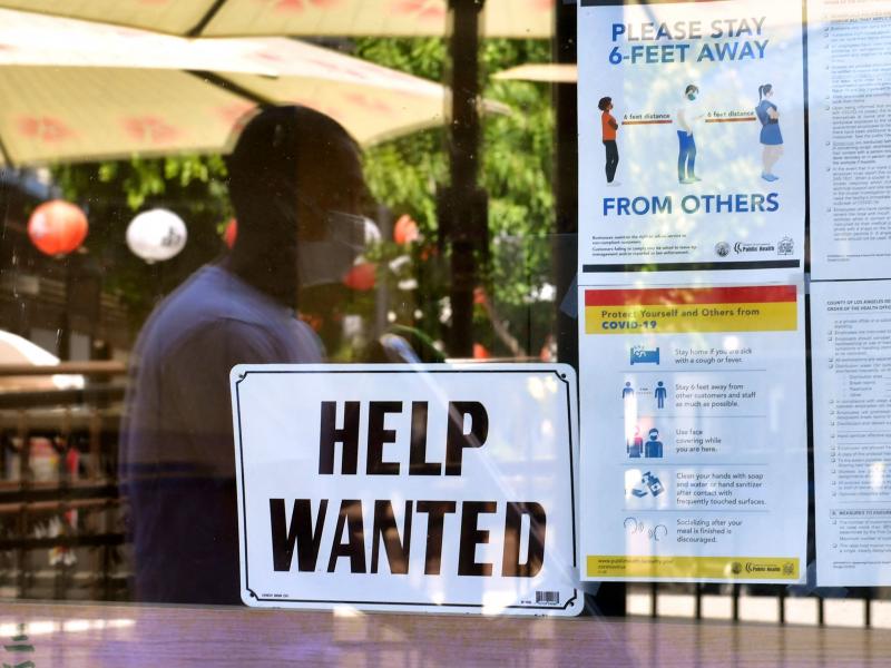 A "Help Wanted" sign is posted beside coronavirus health safety guidelines at a restaurant in Los Angeles on May 28. Businesses are desperate for workers even as millions remain unemployed. Republican governors blame a major unemployment benefit passed du A "Help Wanted" sign is posted beside coronavirus health safety guidelines at a restaurant in Los Angeles on May 28. Businesses are desperate for workers even as millions remain unemployed. Republican governors blame a major unemployment benefit passed du