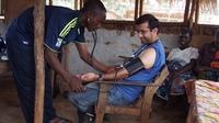 Dr. Raj Panjabi has his blood pressure checked by a Liberian community health worker. Dr. Raj Panjabi has his blood pressure checked by a Liberian community health worker.