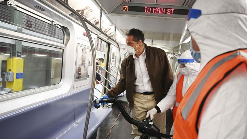 Gov. Andrew Cuomo tries out a spraying device on a New York City subway car during a visit to the Metropolitan Transportation Authority on Saturday. Gov. Andrew Cuomo tries out a spraying device on a New York City subway car during a visit to the Metropolitan Transportation Authority on Saturday.